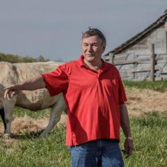 Bucksey Harmon, an Arkansas cattleman, and Monica Paskewitz, NRCS district conservation in Izard County, discuss Harmon's cattle operation