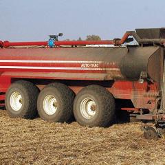A central Iowa farmer knifes in manure on cropland.