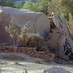 A large boulder that has crushed a building in Zion National Park.