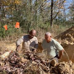 Eddie Davis and Greg McElrath set up the forestland pit.
