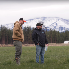 John and Lars stand in John's field at Lazy Z Ranch in Sisters, Ore.