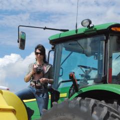 Quenna Terry shooting pics from a Tractor