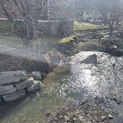 A Sept. 2023 storm caused this stream bank next to an old mill to severly erode.