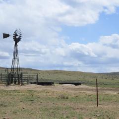Windmill well on ranch in Wyoming, blue skies