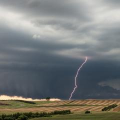 Supercell thunderstorm with wall cloud and lightning