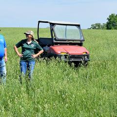 NRCS Grazing Specialist Jeff Matthias talks to a southeast Iowa producers about her grazing system and pasture.