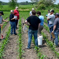 Jason Steele, left, looks at soil probe results during soil health training in southeast Iowa.