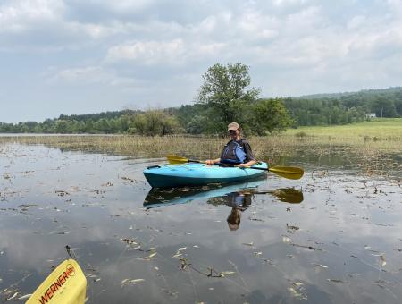Tess Overstreet kayaking through flooded easements