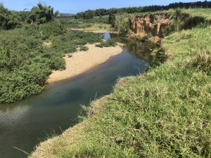 Photo of streambank mass wasting and sedimentation in the Rio Fajardo watershed.