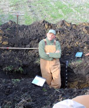 soil scientist in dug pit