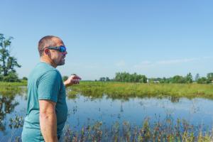 John Bellman gives a tour of his Wetland Reserve Easement in Marshall County, Indiana to Troy Manges, Indiana NRCS district conservationist, on June 14, 2022.