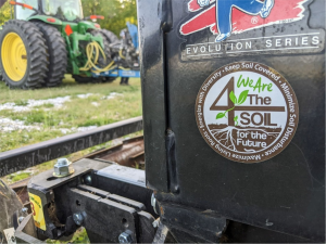 Soil health message sticker on farm equipment.