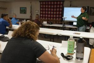 Sandi Parriott listens and takes notes as Heidi Barber teaches a summer BG2BG bootcamp.
