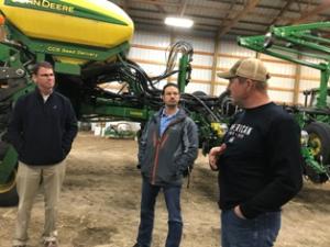 Matt Lohr (left), chief of the USDA NRCS, visits with Joshua Monson (center), NRCS district conservationist, Fargo, and Tyler Zimmerman (right) during a 2019 tour of Zimmerman’s farm