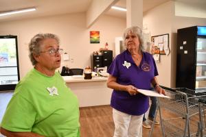 Novalene Thurston and Peggy Wright, both from food pantries in the tri-county area, explain the value of receiving fresh produce from the NRG Dewey Prairie Garden.