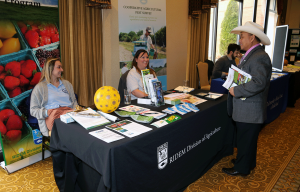 Rhode Island NRCS State Conservationist, Pooh Vongkhamdy (right), visits the RI DEM Ag Division exhibit at the 2020 RI Women in Agriculture Conference.