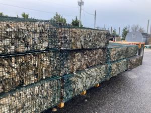 Oyster mesh cages stacked on the shores of New Jersey. 