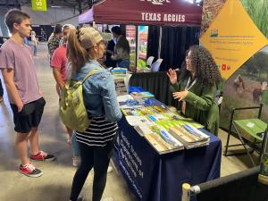 Yesenia Diaz, and NRCS employee at the McKinney Field Office in McKinney, Texas visits with high school and college students about career opportunities with NRCS. 