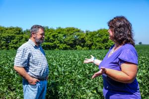 Darcy Maulsby discusses the importance of the windbreak on her families operation with Jeremy Viles, District Conservationist with NRCS in Calhoun County.