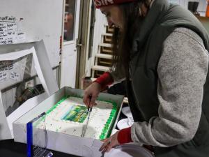 Whitney cutting the cake