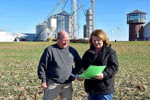 Adams County farmer Ray Gaesser (left) discusses his EQIP contract with NRCS District Conservationist Missy Johnson.