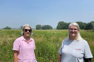 Two women standing in a Wisconsin prairie