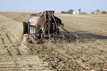 A Hardin County, Iowa, farmers knifes manure into his cropland.