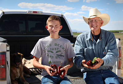 Farmer Ed and his son Mikey Curry showcasing the familys main crop, chile peppers