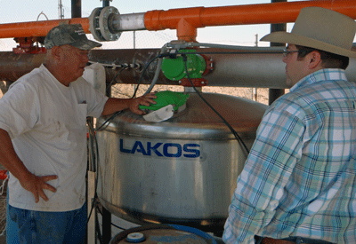 Farmer installs dripline irrigation system through NRCS assistance.